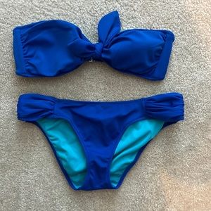 Blue Victoria’s Secret two piece Swimsuit with cute front tie bow top knot.